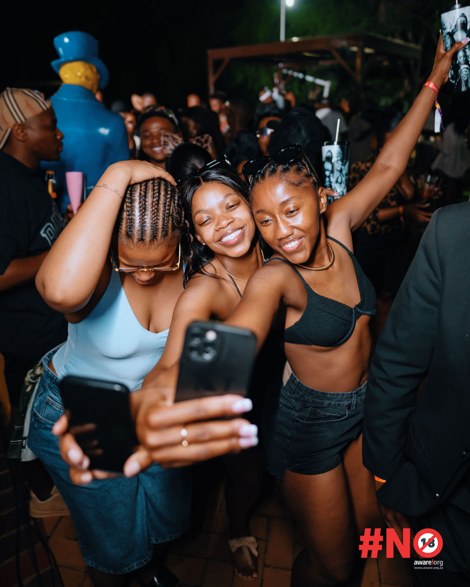 Group of friends taking a selfie at the night party