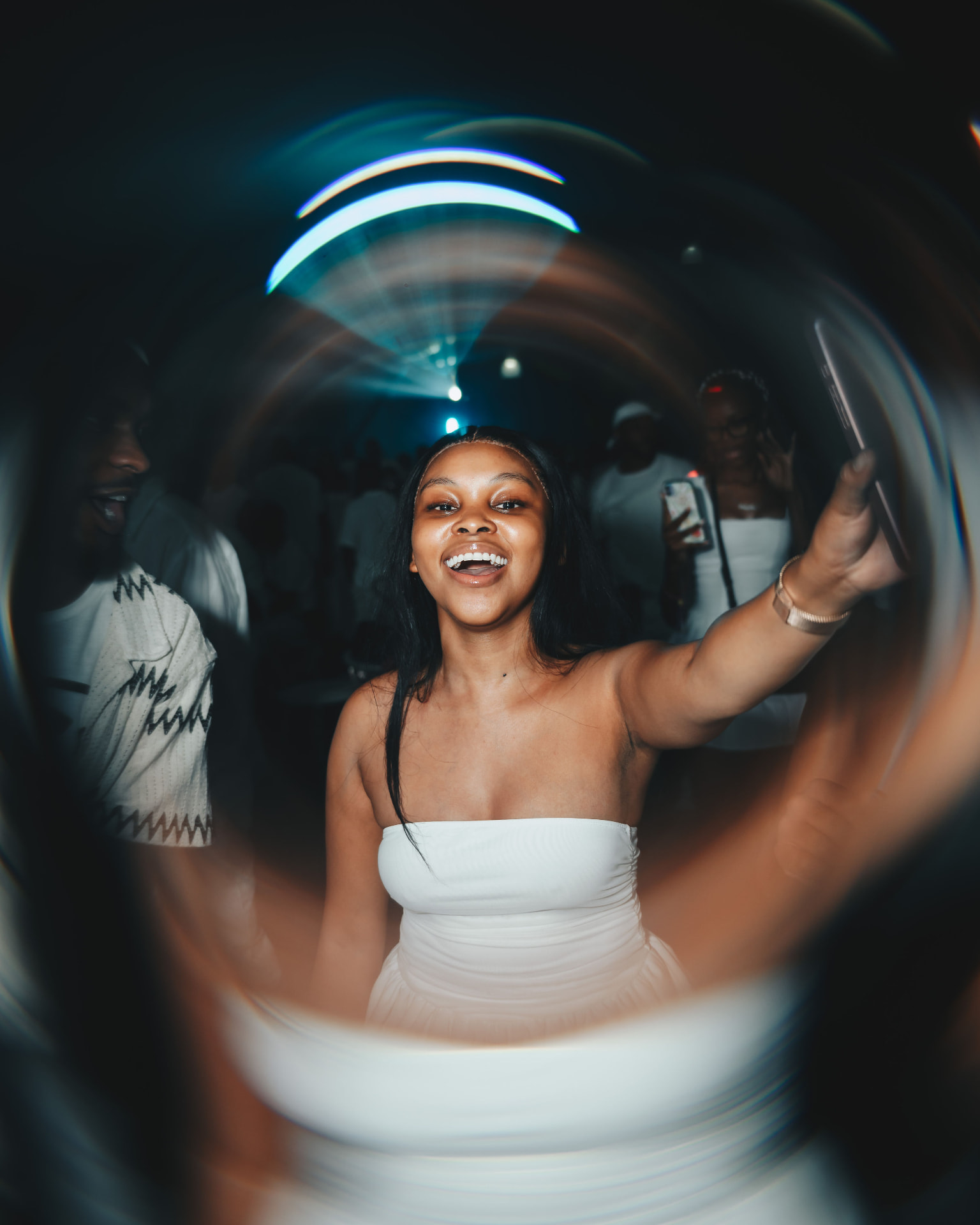 Guest in white taking a selfie with a fisheye lens effect